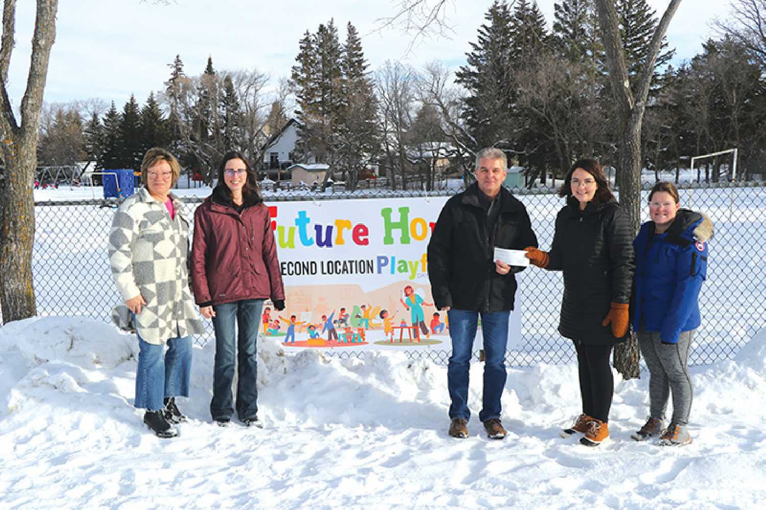 From left to right: Wendy Leeds, Jodie Stewart and Corey Popowich with Sharpe's Soil Services present a cheque for $15,000 to Brittany Glasser and Samantha Campbell with the Daycare Fundraising Committee.